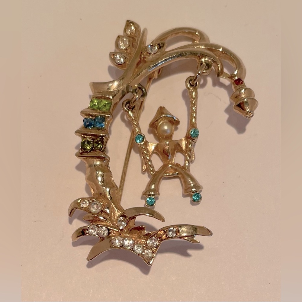 Child in swing brooch. Child and swing move